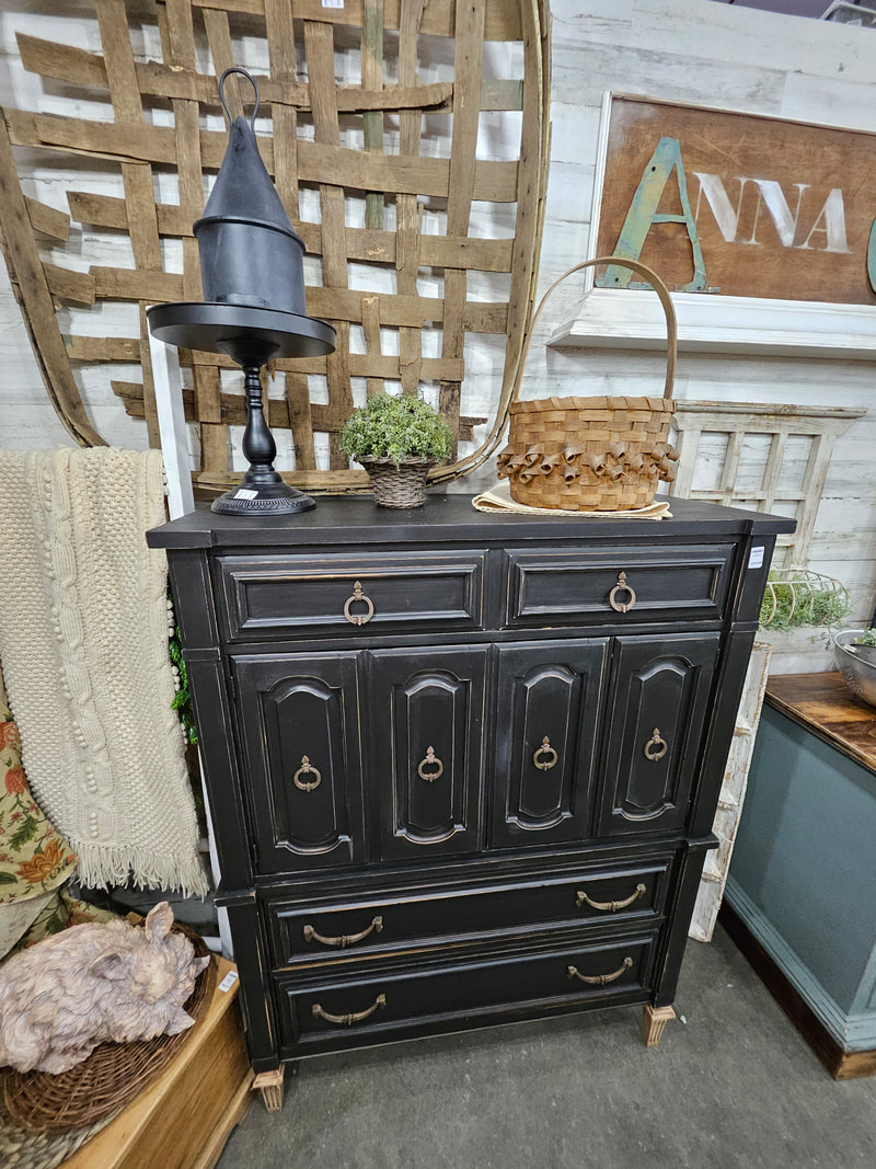 Tall black distressed dresser with vintage-style hardware