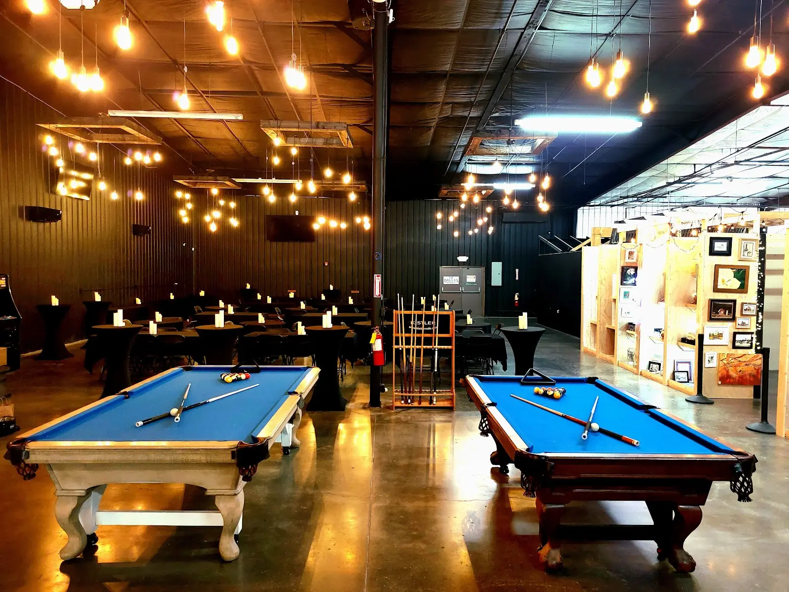Billiards and warm lighting inside The Dallas Markets event space