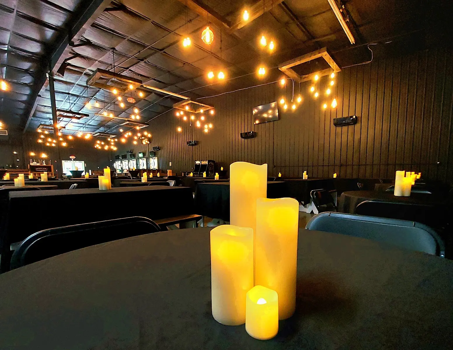 Battery candles glowing on a prepared guest table