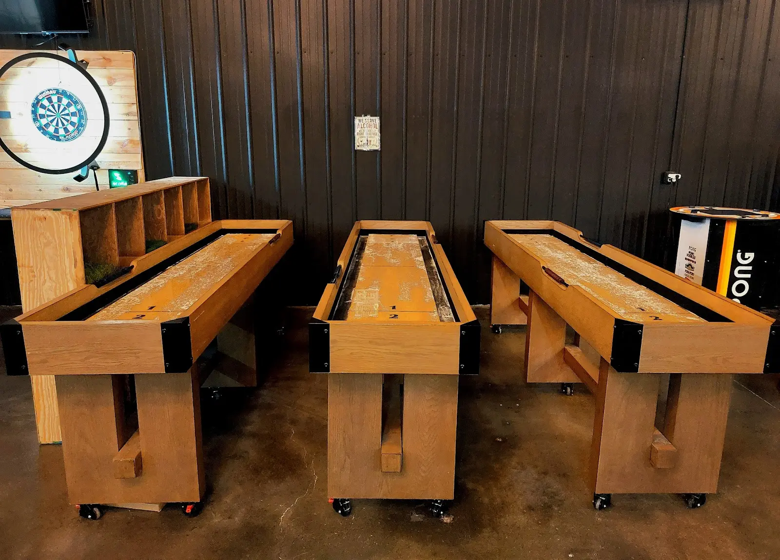 Shuffleboard tables along the entertainment wall