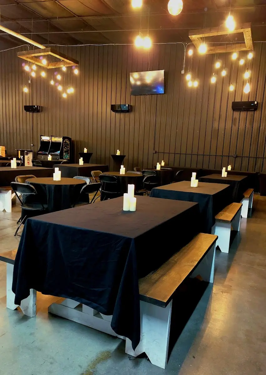 Candlelit guest table with black linens